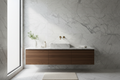 White honed marble vessel basin on dark walnut floating vanity with brushed gold faucet